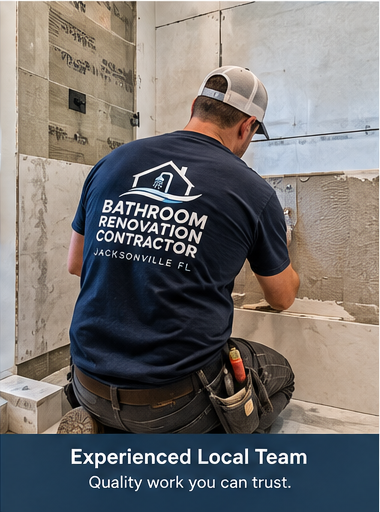 Tile setter installing wall tile during a bathroom renovation